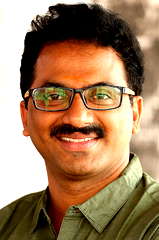 Ashok G.