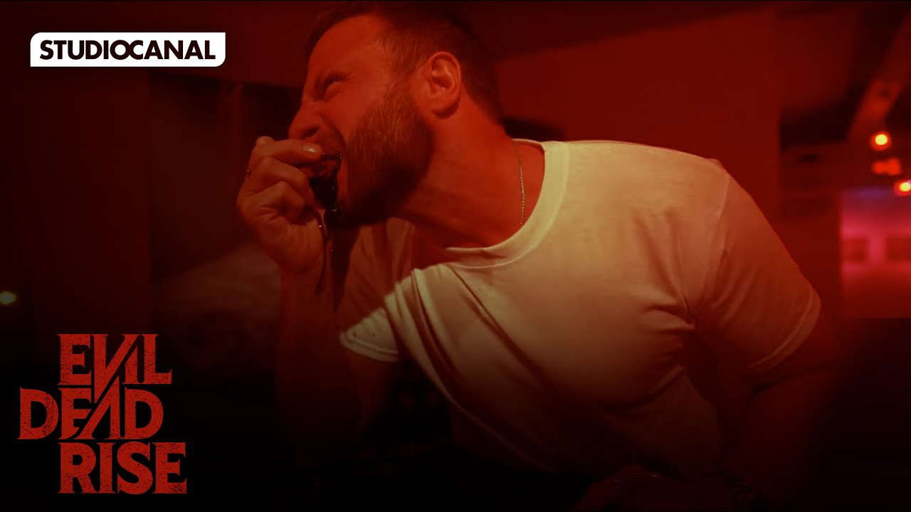 Man eating glass at Evil Dead Rise screening