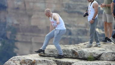 Dangling feet off cliff at the Grand Canyon, Idiot 3 poster