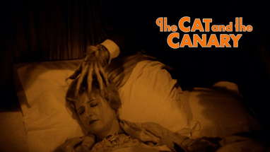 A hand creepily reaches for the necklace worn by Annabelle poster